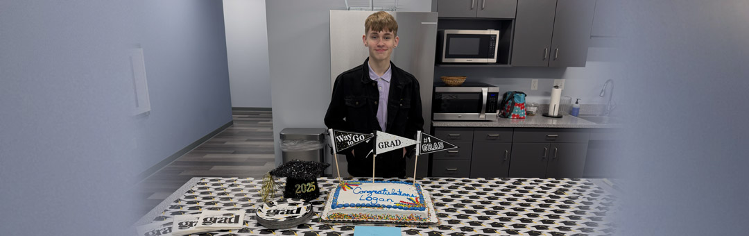 ManTraCon welcomes Logan Ridings with a graduation cake.