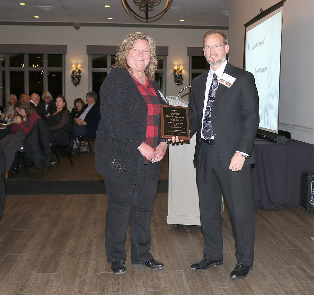 SIWDB Chair Terance Henry honors SIWDB members who have given many years of dedicated service to the board.