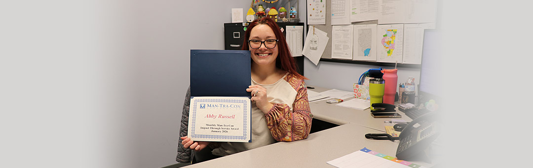 Abby Russell holds award certificate.