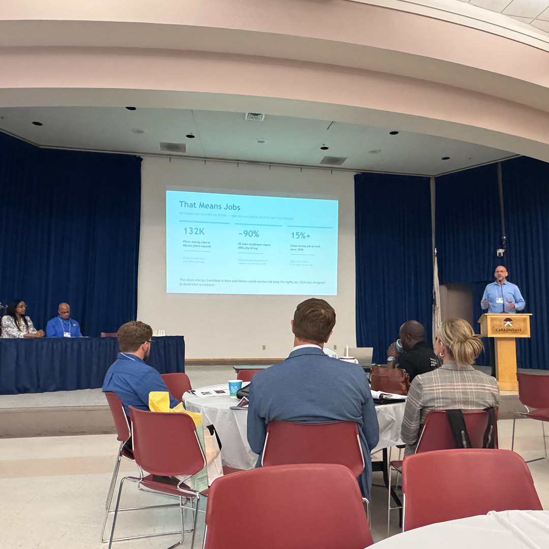 Man-Tra-Con CEJA Program Director Greg Bouhl (right) talks about the CEJA clean energy workforce training program.