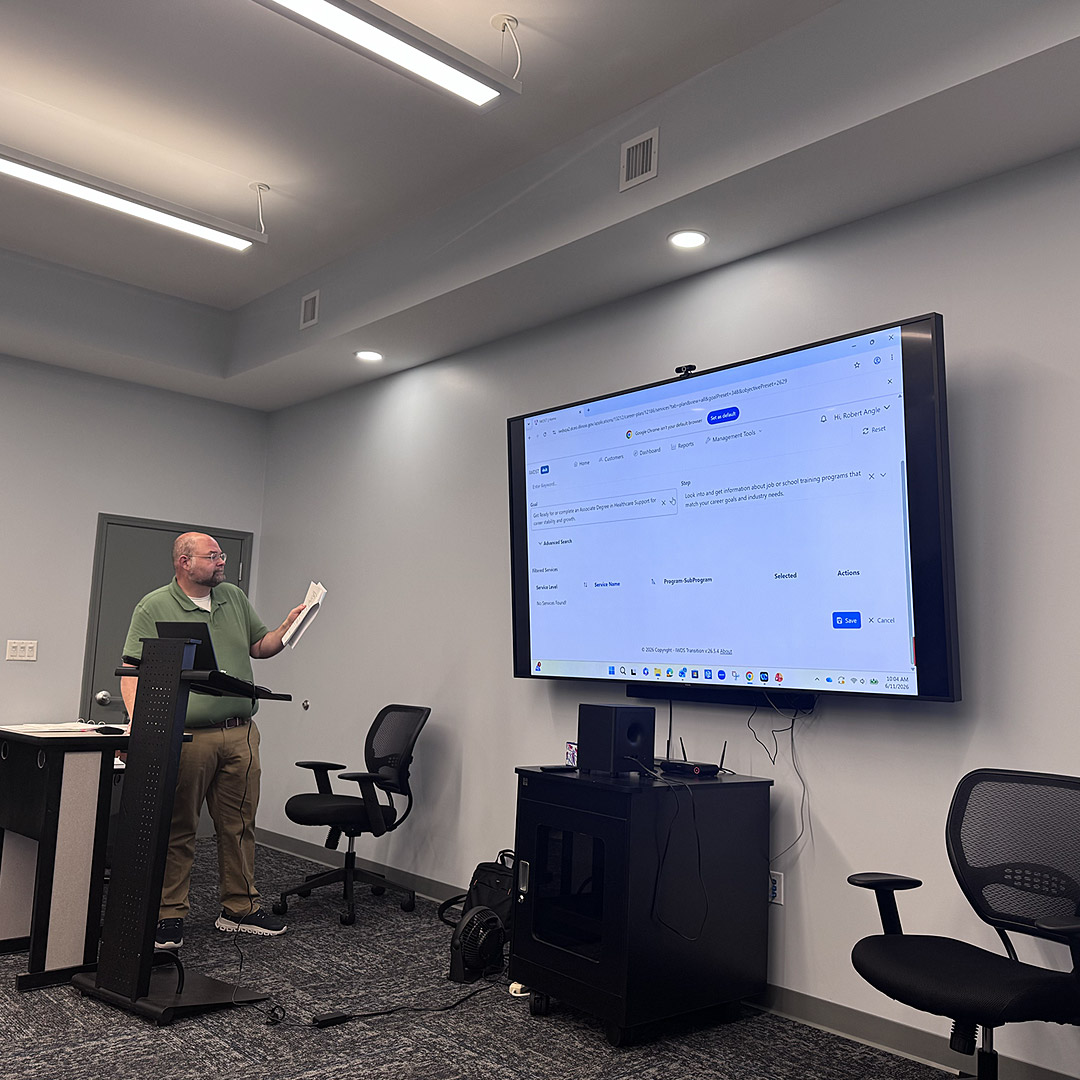 Re-entry & Integration Career Specialist Robert Angle explains elements of the new IWDS 2.0 software to Man-Tra-Con staff.