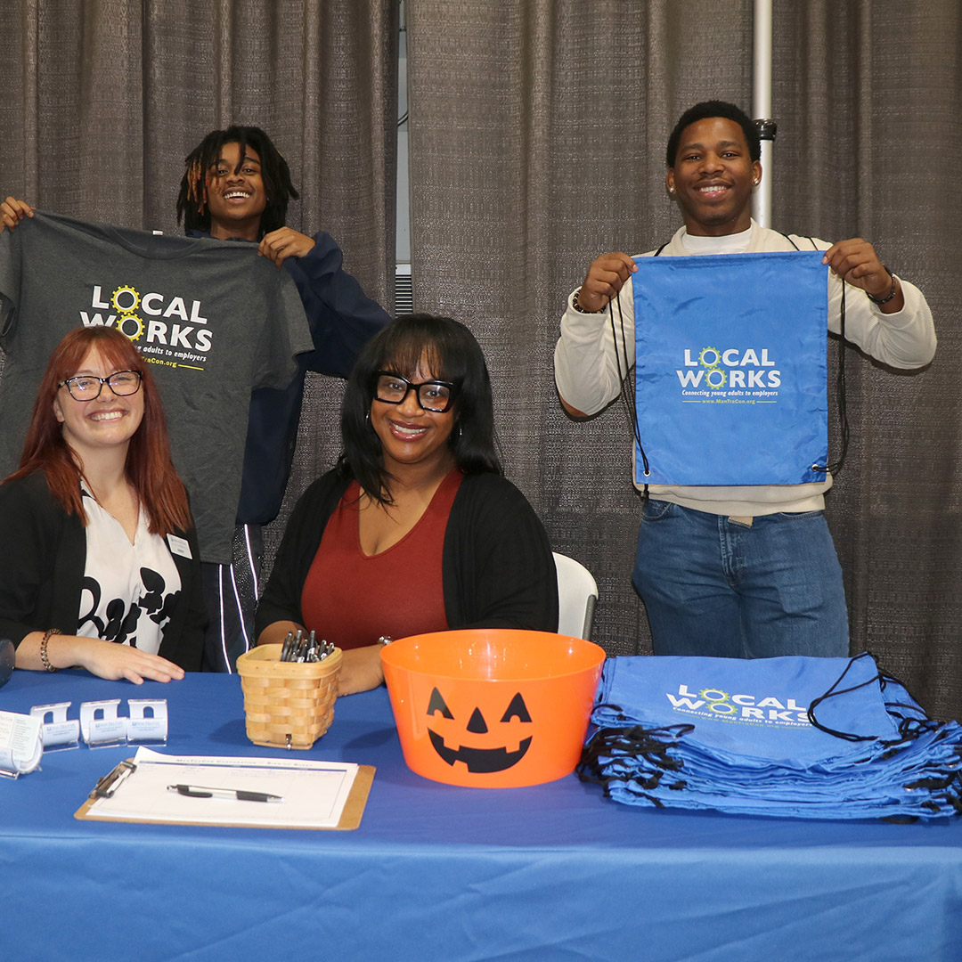 Employer Services Coordinator Abby Russell (left) and Community Resource Specialist Charelle Byrd greet students at the career fair.
