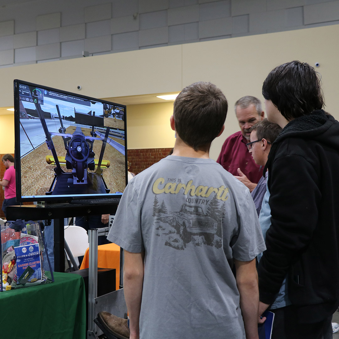 Students gather to experience and learn about simulation software.