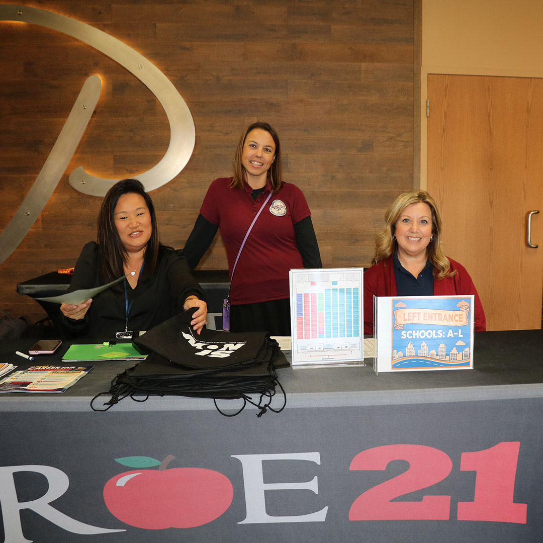 Staff from the Regional Office of Education #21 and Regional Office of Education 30 welcome students to the career fair.