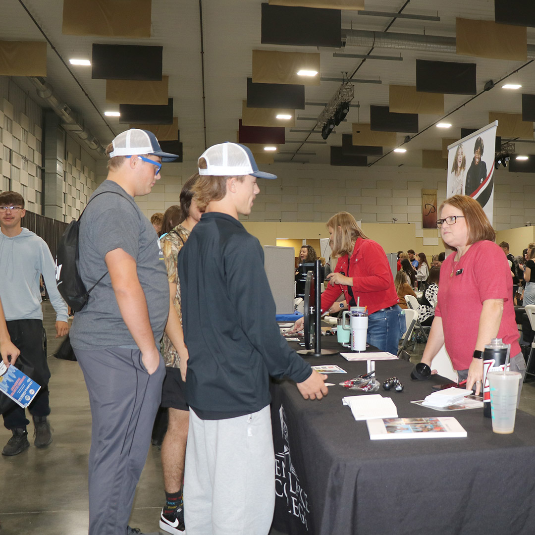 Students visit the Rend Lake College table.