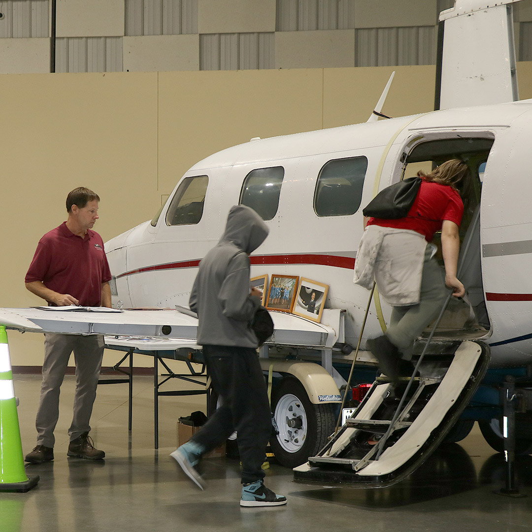 Students check out the inside of a plane at the Mt. Vernon Airport display.