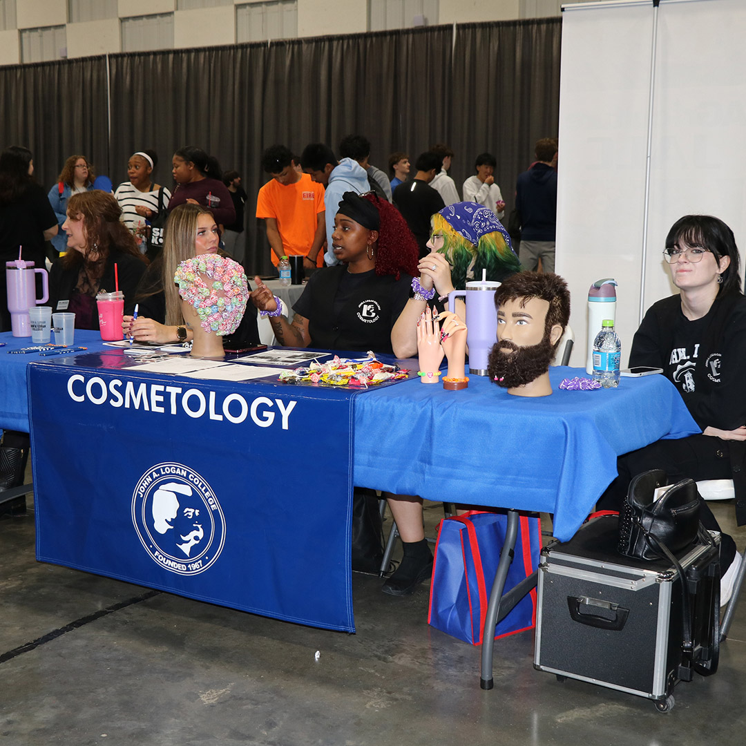 Staff from the John A. Logan College Cosmetology program greet students at the career fair.