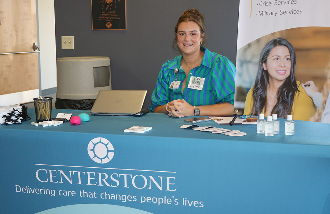 Emily Stroud from Centerstone welcomes attendees at the summit.