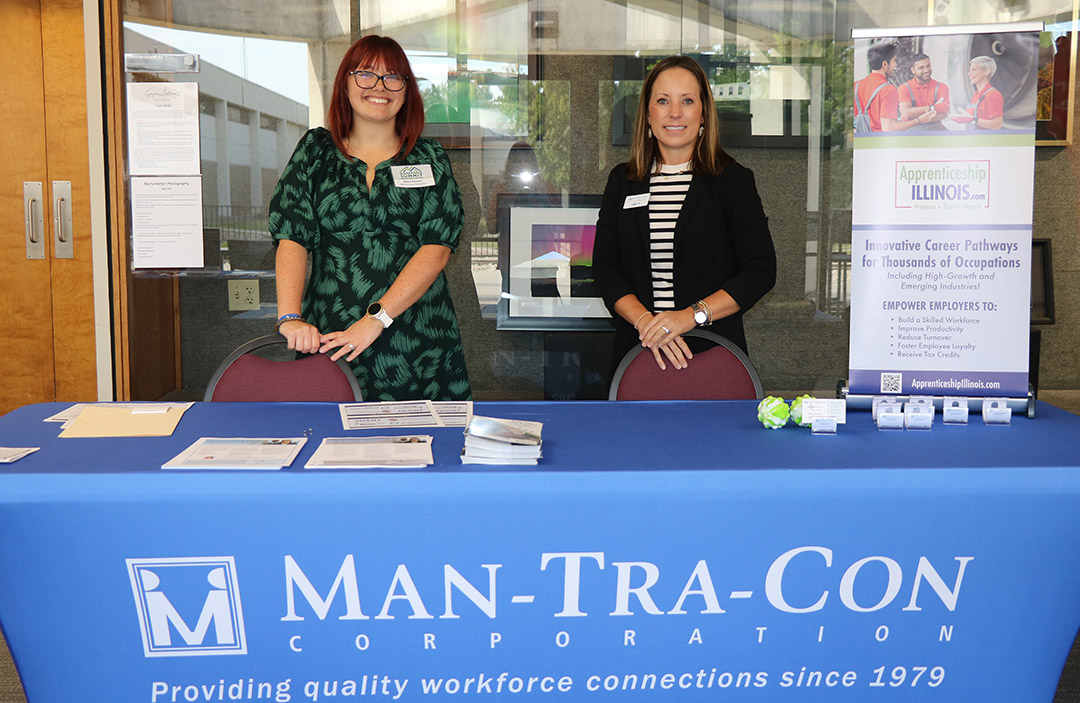 Employer Services Coordinator Abby Russell (left) and Employer Services & Special Grants Director Emily Perks at the Man-Tra-Con table.